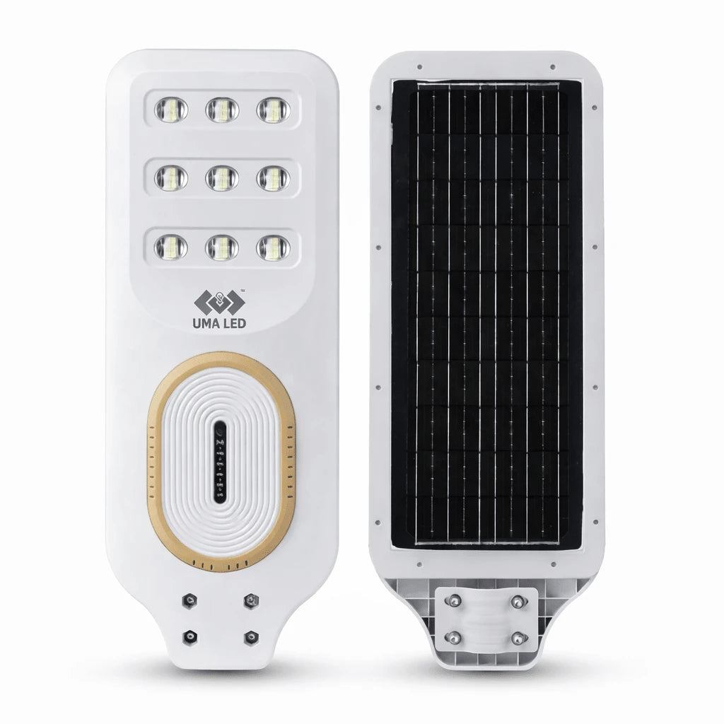A white solar-powered street light shown from two angles: the front view features multiple LED light bulbs, a gold oval accent, and the UMA LED logo, while the back view shows a large black solar panel. The products are displayed on a clean white background.