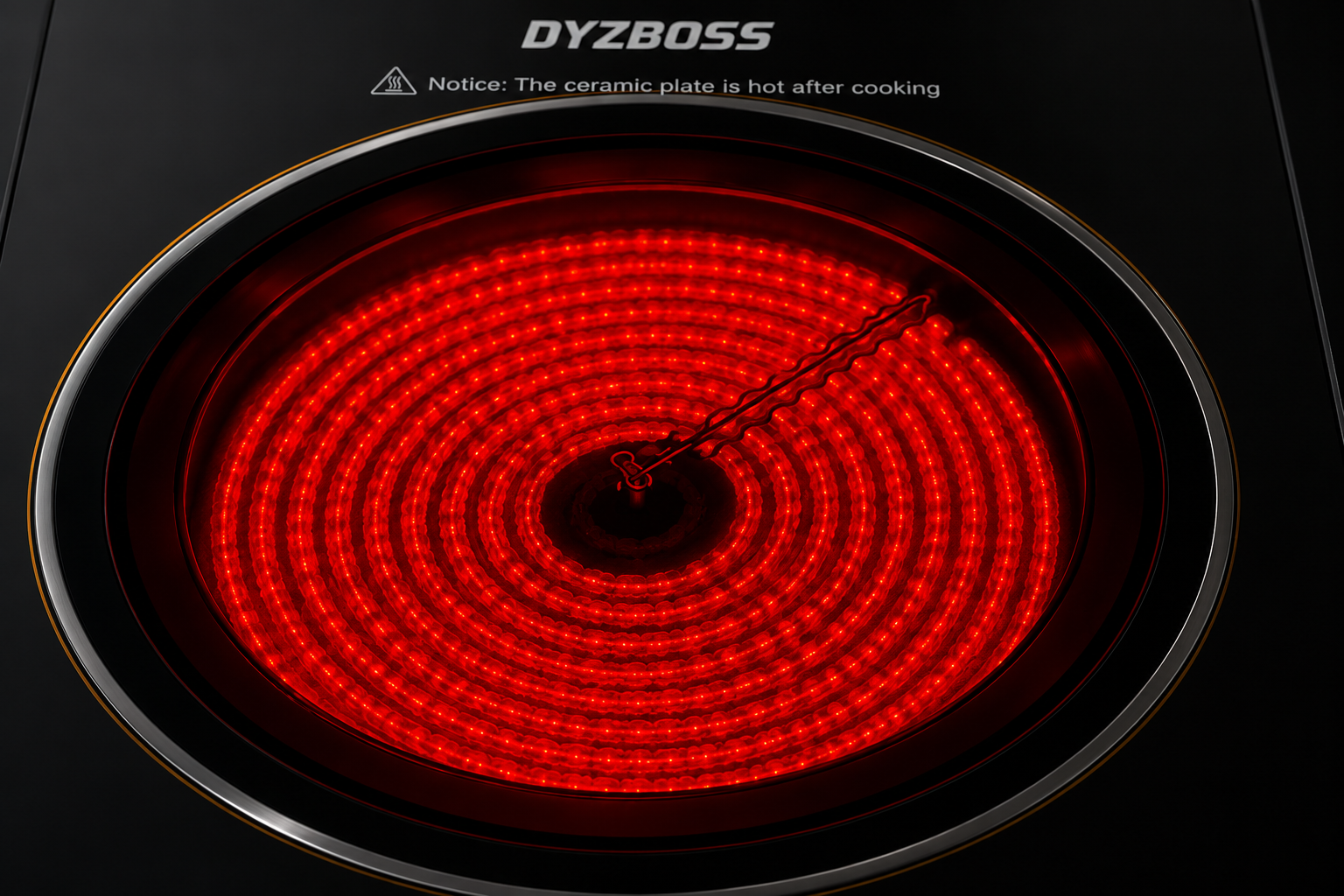A close-up of a black induction cooktop with a glowing red circular heating zone and the DYZBOSS logo printed above it.