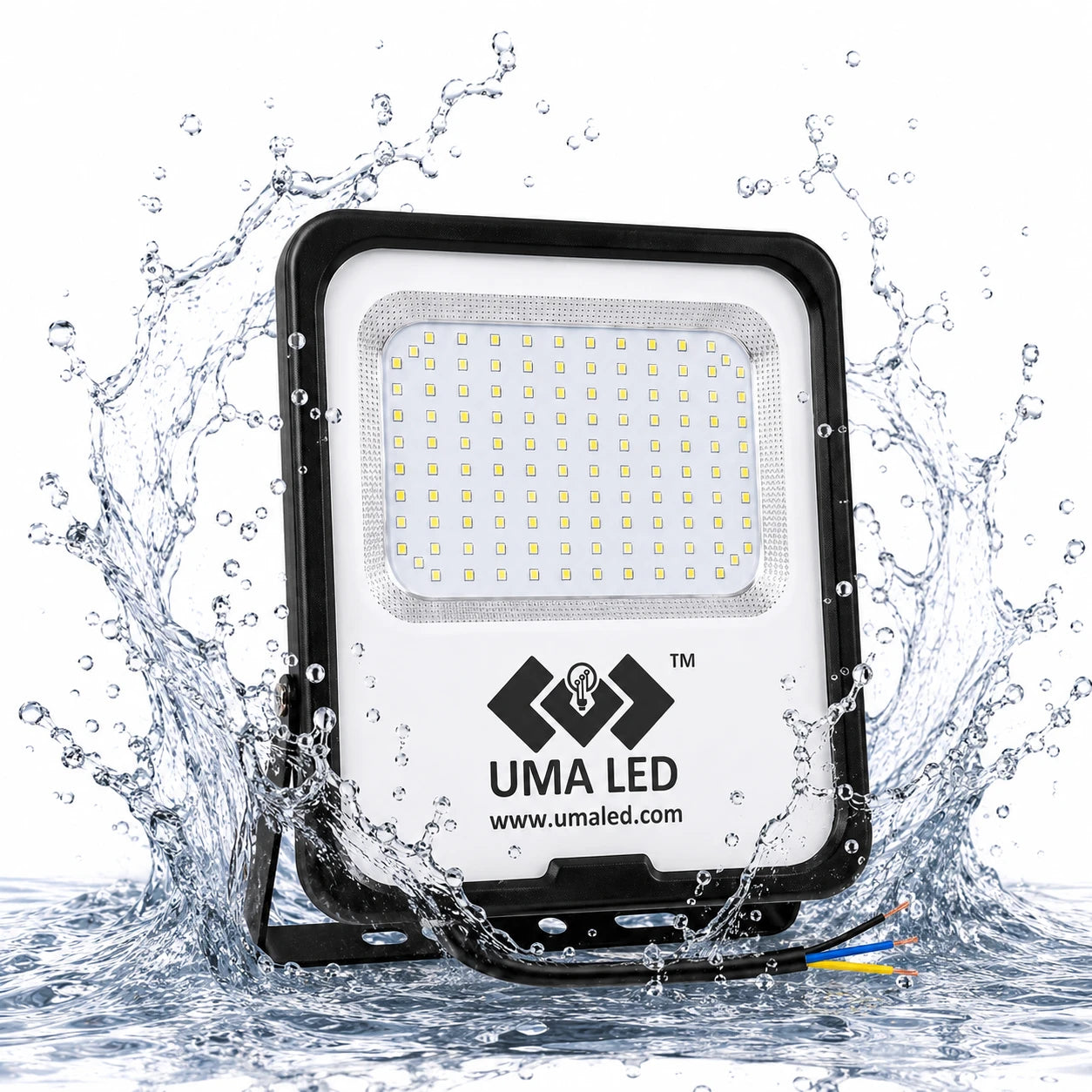 UMA LED floodlight with a black frame and white faceplate, surrounded by dynamic water splashes on a white background.