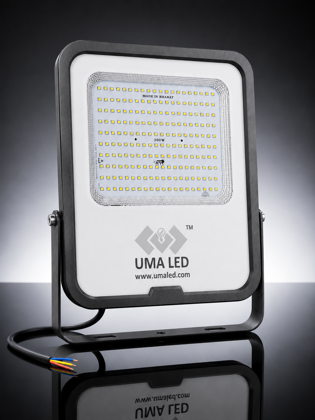 UMA LED 200W square floodlight with a white faceplate, black metal housing and bracket, and a black cable with multicolored wire ends, shown on a reflective black background.