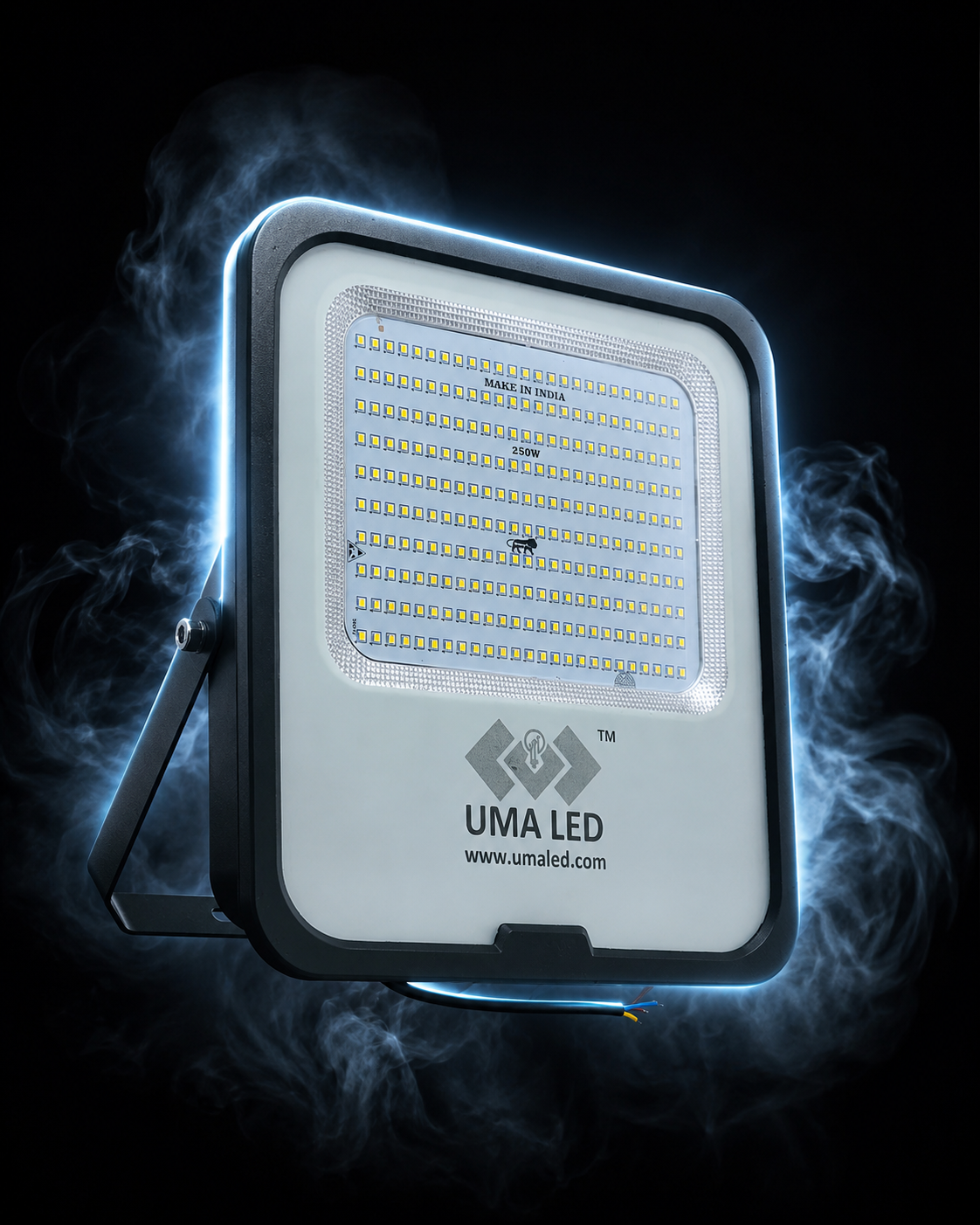 UMA LED outdoor floodlight with a white faceplate, black housing, and integrated mounting bracket, shown against a dark background with dramatic blue smoke effects.