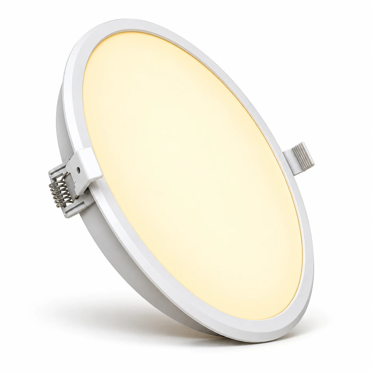 A flush-mount circular LED recessed light with a white frame, shown illuminated with a warm yellow glow against a clean white background.