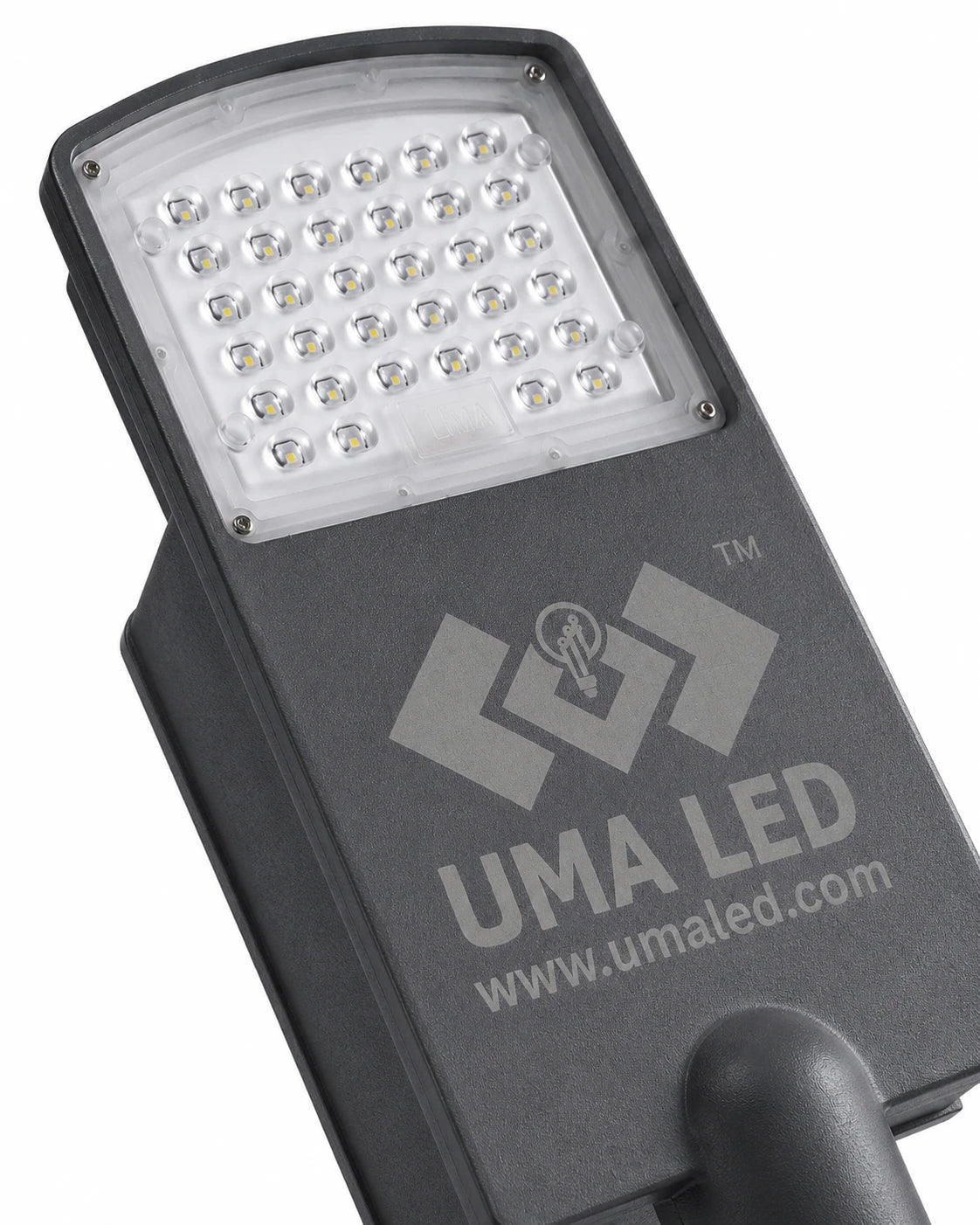 A close-up of a dark gray UMA LED street light housing, showing the front LED panel with multiple small white LEDs and the UMA LED logo printed on the side, set against a plain white background.
