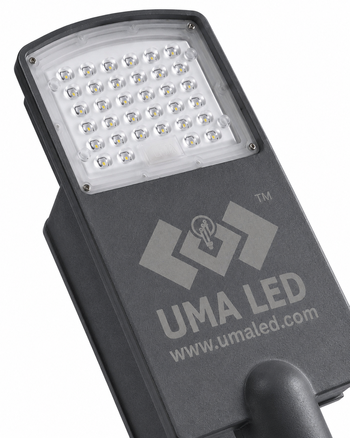 A close-up of a dark gray UMA LED street light housing, showing the front LED panel with multiple small white LEDs and the UMA LED logo printed on the side, set against a plain white background.
